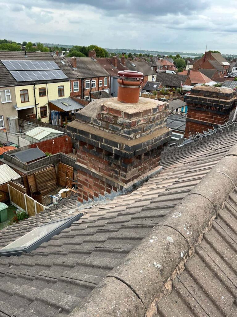 This is a photo taken from a roof which is being repaired by Gamston Roofing Repairs, it shows a street of houses, and their roofs